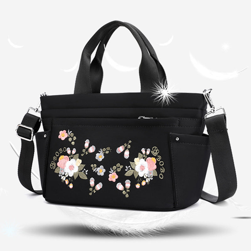 Umhängetasche mit Blumenstickerei und mehreren Taschen