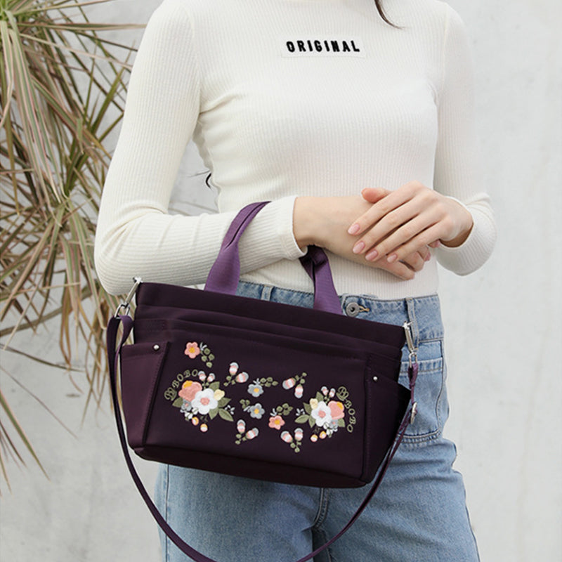 Umhängetasche mit Blumenstickerei und mehreren Taschen