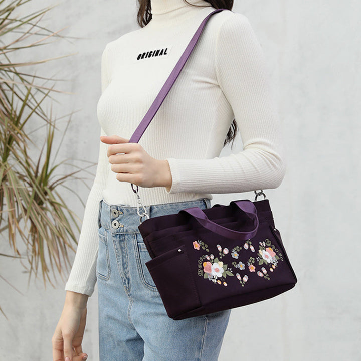 Umhängetasche mit Blumenstickerei und mehreren Taschen