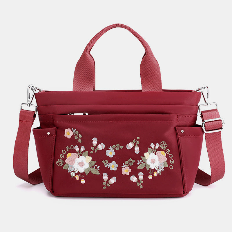 Umhängetasche mit Blumenstickerei und mehreren Taschen