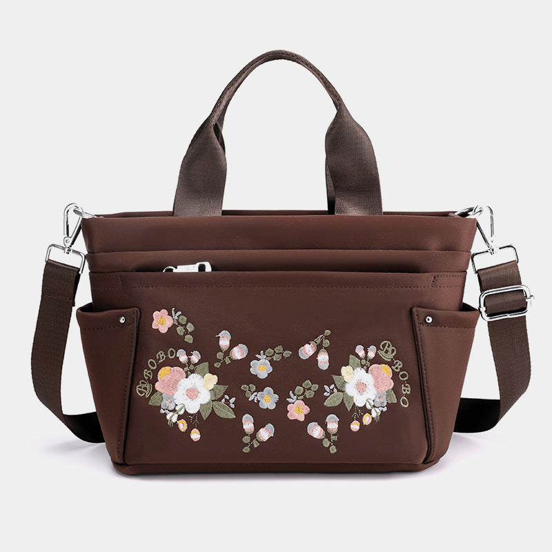 Umhängetasche mit Blumenstickerei und mehreren Taschen