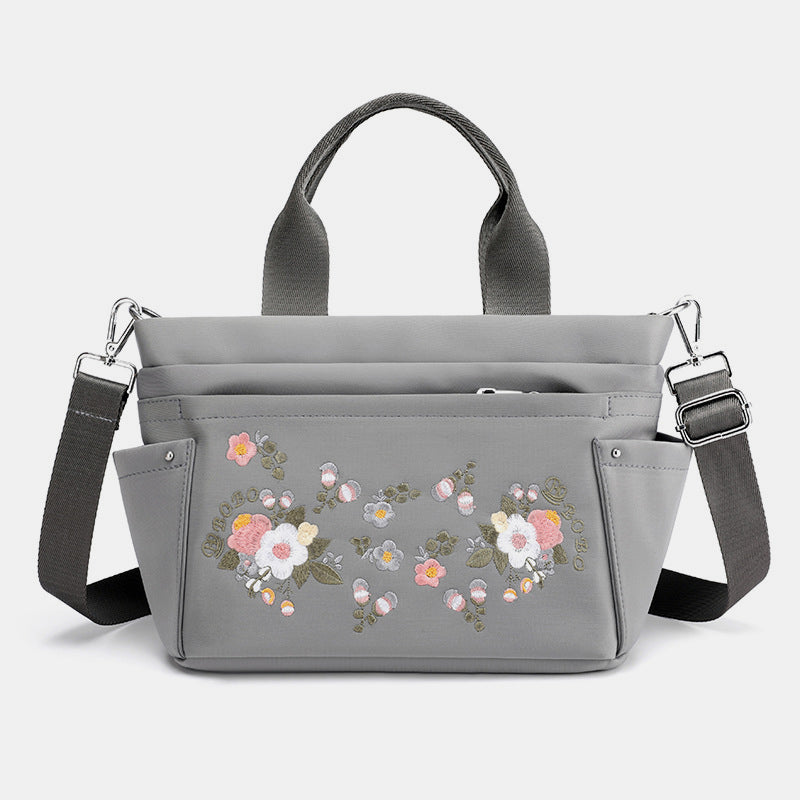 Umhängetasche mit Blumenstickerei und mehreren Taschen