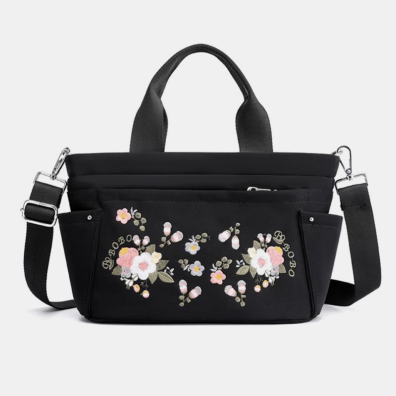 Umhängetasche mit Blumenstickerei und mehreren Taschen