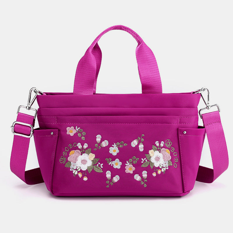 Umhängetasche mit Blumenstickerei und mehreren Taschen