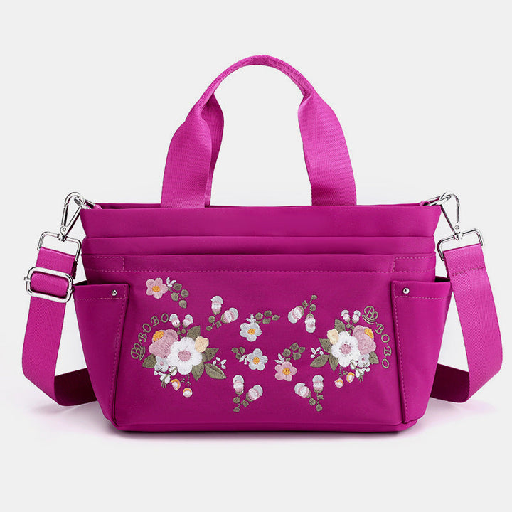 Umhängetasche mit Blumenstickerei und mehreren Taschen