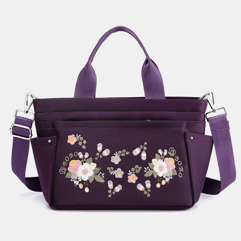 Umhängetasche mit Blumenstickerei und mehreren Taschen