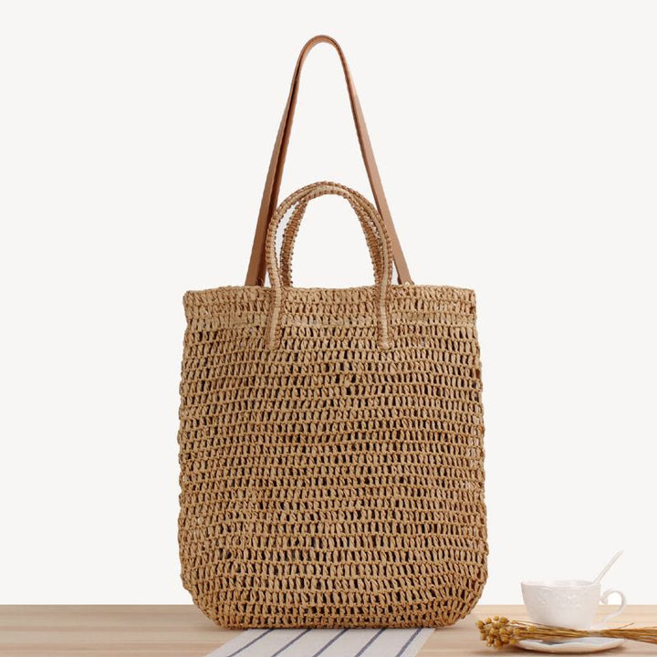 Tragetasche für Damen, ausgehöhlte, tragbare Strandtasche aus Stroh
