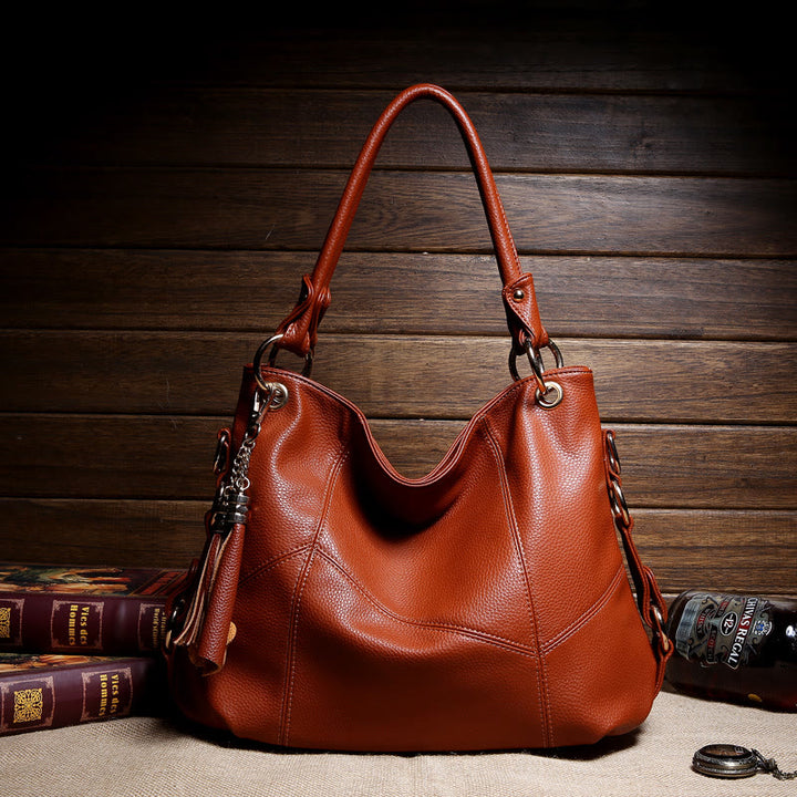 Einfarbige Schultertasche für Damen mit Quastendekor, große Unterarmtasche