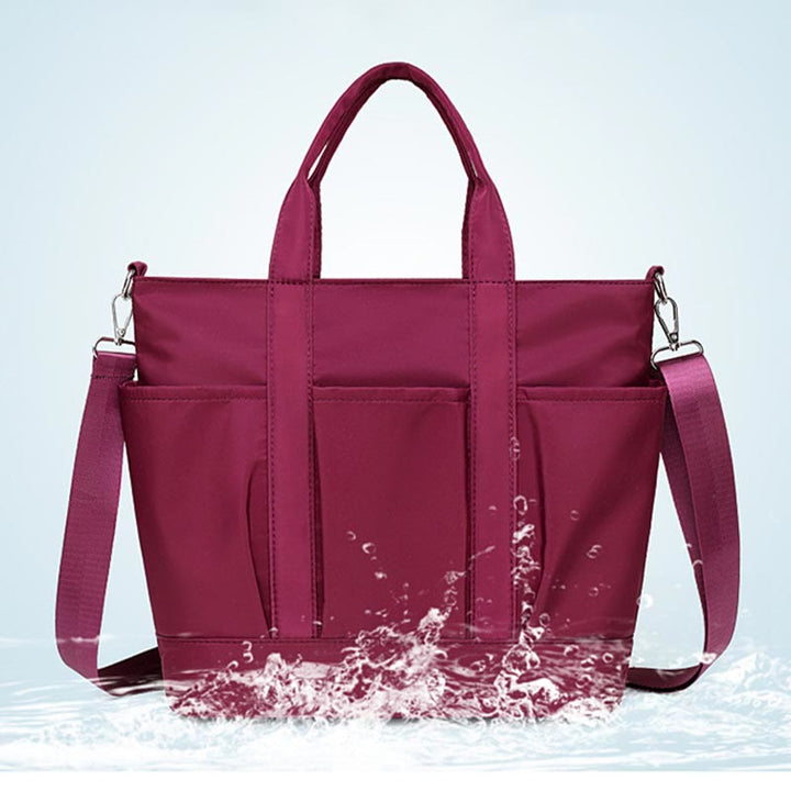 Tragetasche für Damen, minimalistische, wasserdichte Umhängetasche aus Oxford-Gewebe in Lila