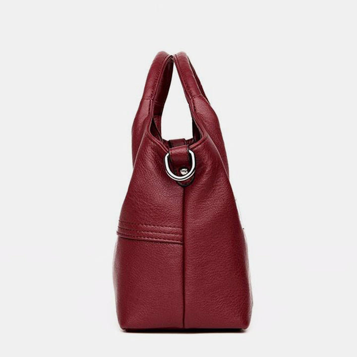 Weiche Lederhandtasche mit Nähten und fester Umhängetasche