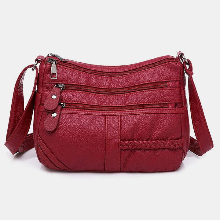 Einfarbige Umhängetasche mit mehreren Taschen