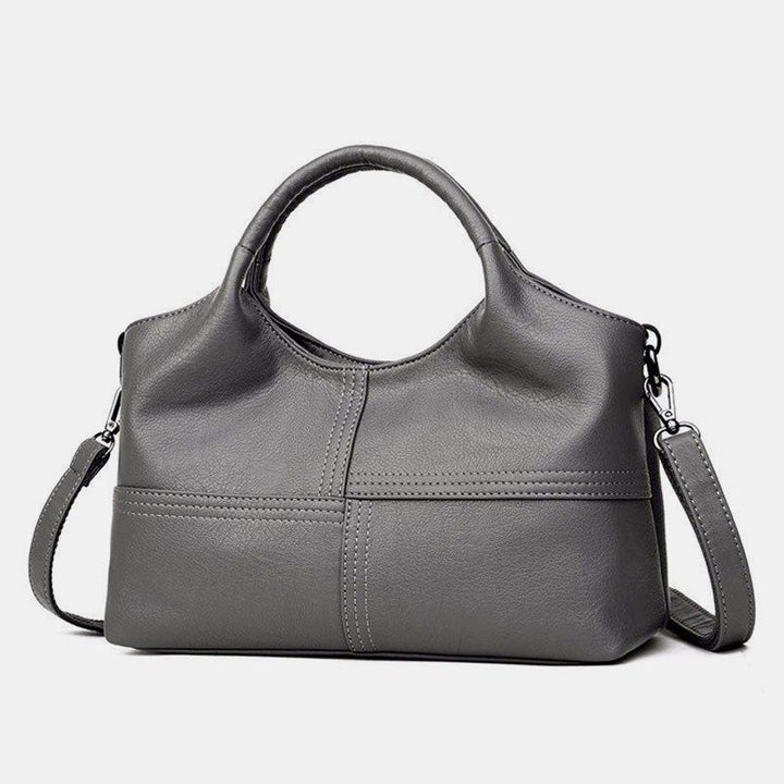 Weiche Lederhandtasche mit Nähten und fester Umhängetasche
