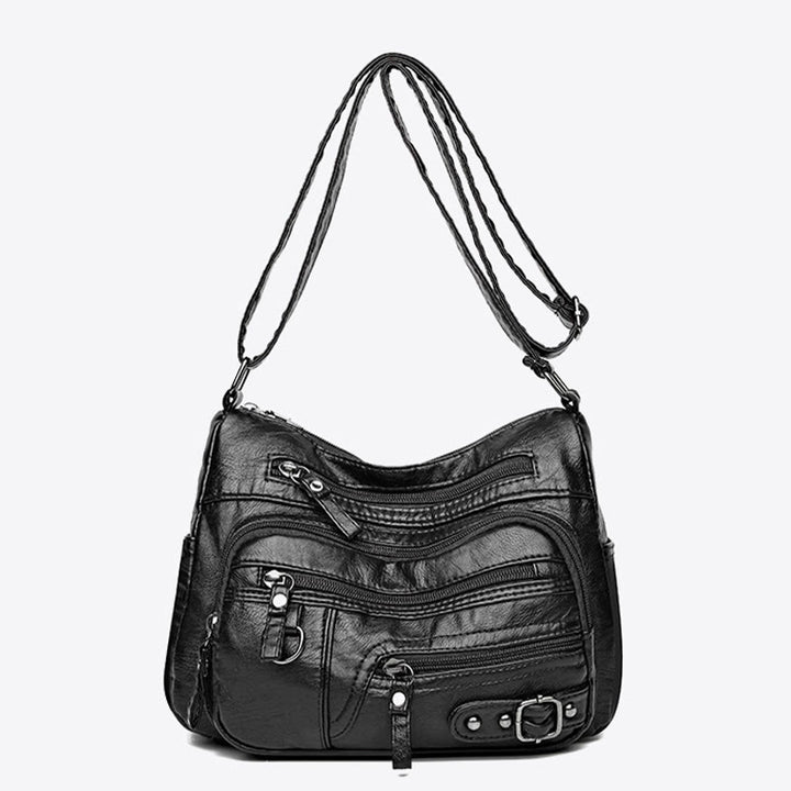 Minimalistische Ledergeldbörse mit mehreren Taschen für Damen. Organisierte Umhängetasche