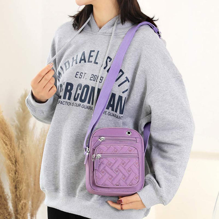 Lässige Umhängetasche aus Nylon mit mehreren Taschen und Loch für Kopfhörer