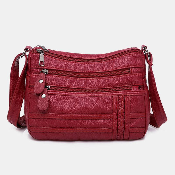 Einfarbige Umhängetasche mit mehreren Taschen