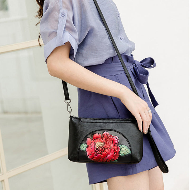 Elegante Umhängetasche für Damen, halbrund, mit Blumenprägung