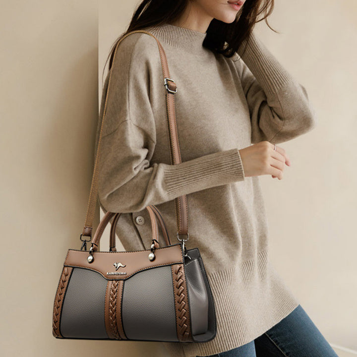 Horizontale Tasche mit Henkel oben und Twist-Streifen, süße Umhängetasche
