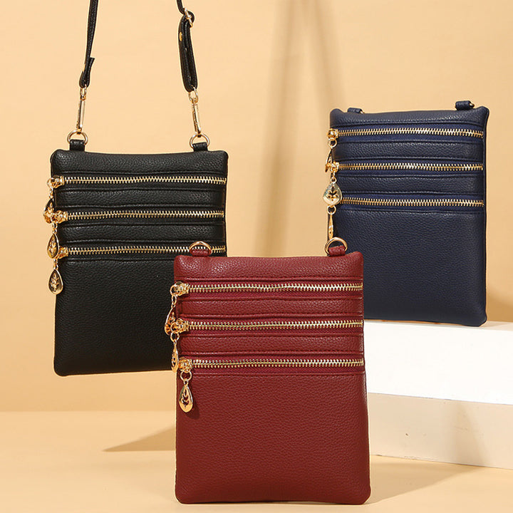 Umhängetasche aus Kunstleder mit drei Fächern, Handytasche