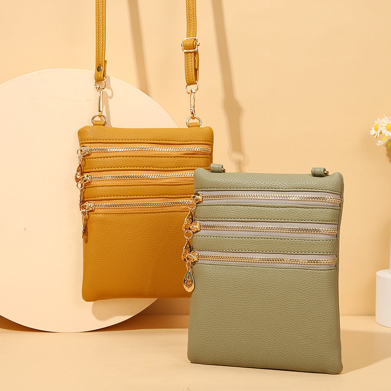 Umhängetasche aus Kunstleder mit drei Fächern, Handytasche