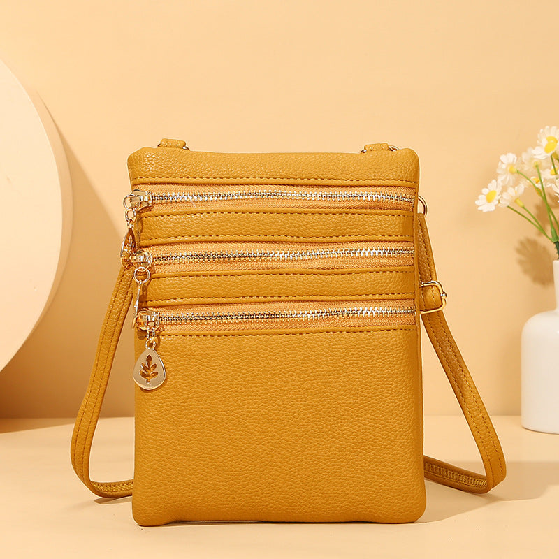 Umhängetasche aus Kunstleder mit drei Fächern, Handytasche