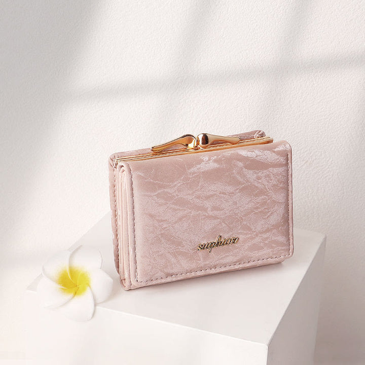 Kleine dreifach faltbare Geldbörse aus weichem Cord für Damen mit Kiss-Lock-Fach