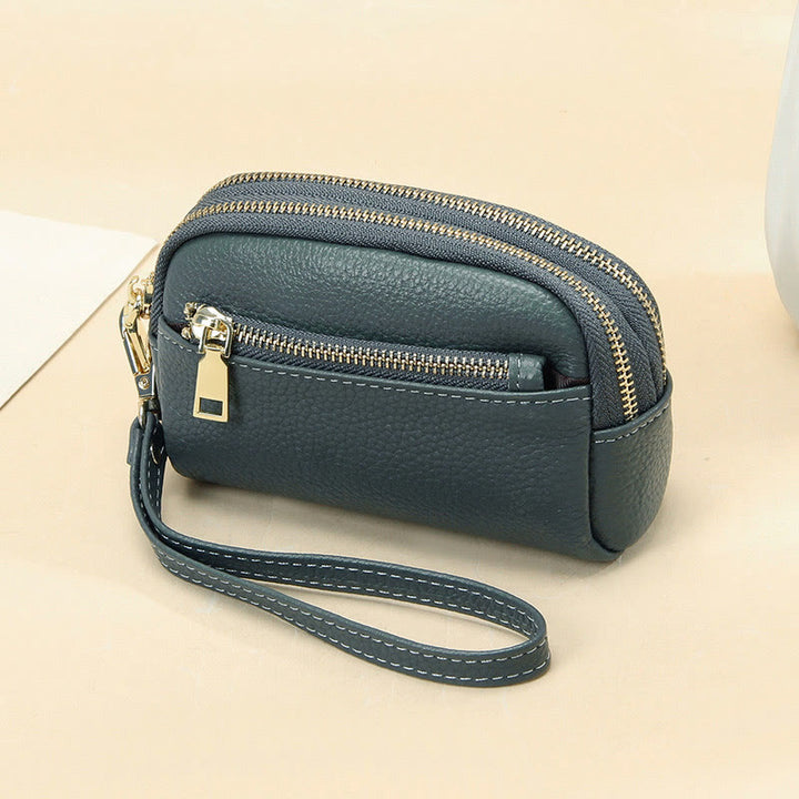 Kleine Geldbörse aus echtem Leder mit mehreren Taschen und Handschlaufe