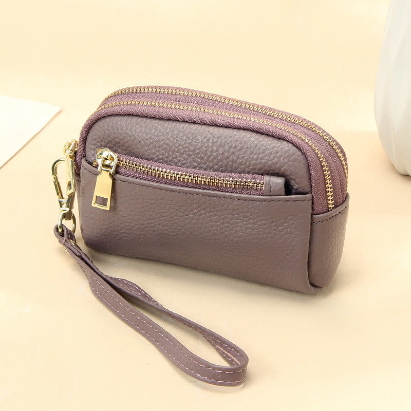 Kleine Geldbörse aus echtem Leder mit mehreren Taschen und Handschlaufe