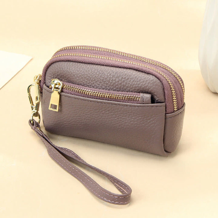 Kleine Geldbörse aus echtem Leder mit mehreren Taschen und Handschlaufe