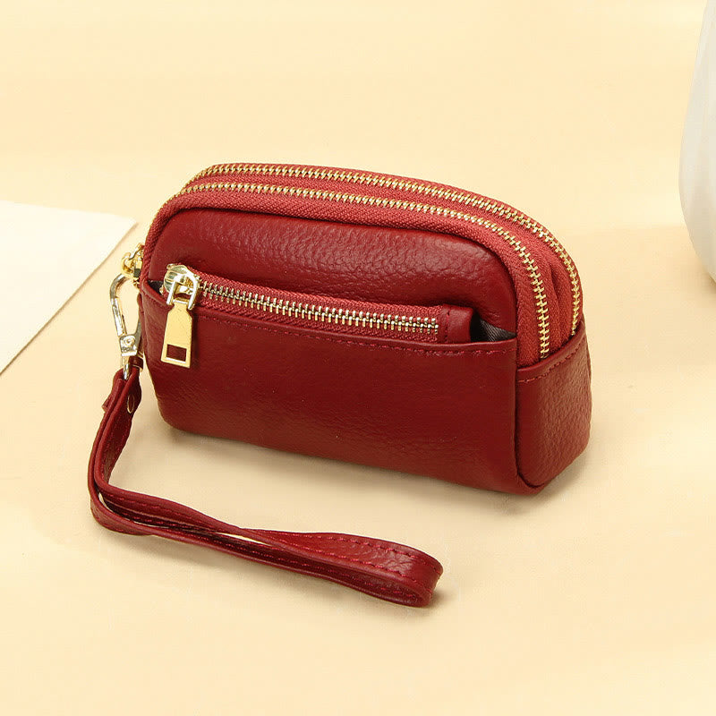 Kleine Geldbörse aus echtem Leder mit mehreren Taschen und Handschlaufe