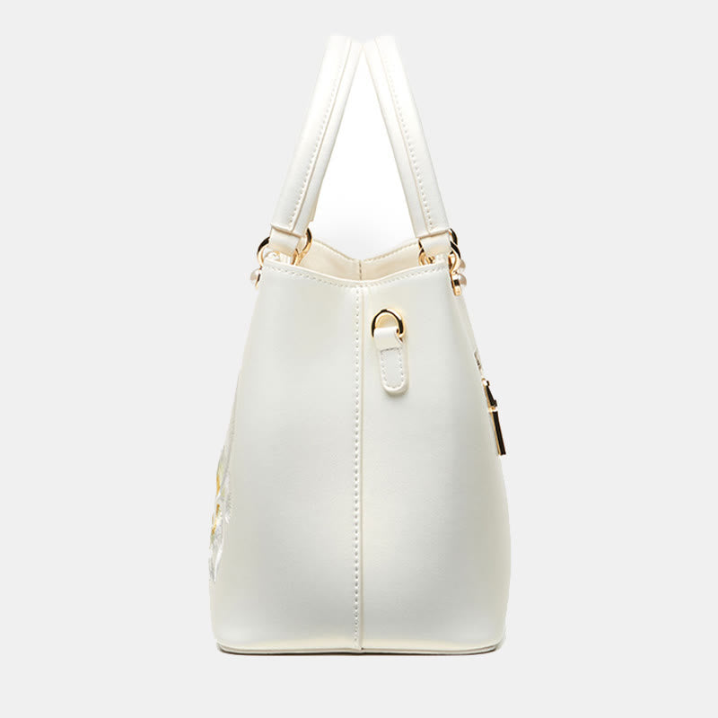 Handtasche aus perlmuttfarbenem, weißem Leder mit Lotusstickerei