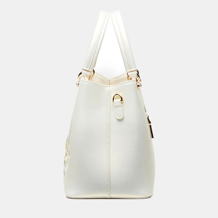Handtasche aus perlmuttfarbenem, weißem Leder mit Lotusstickerei