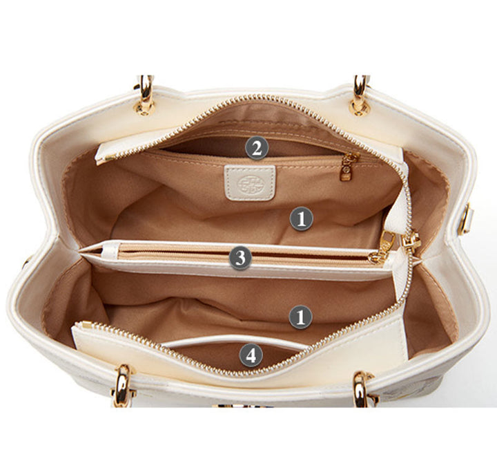 Handtasche aus perlmuttfarbenem, weißem Leder mit Lotusstickerei