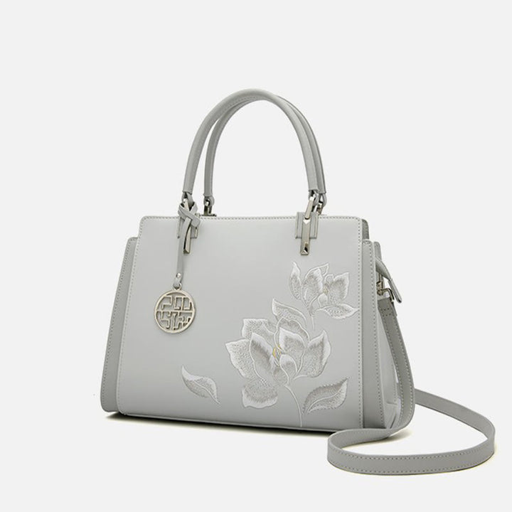 Handtasche aus echtem Leder mit Magnolienblumen-Stickerei