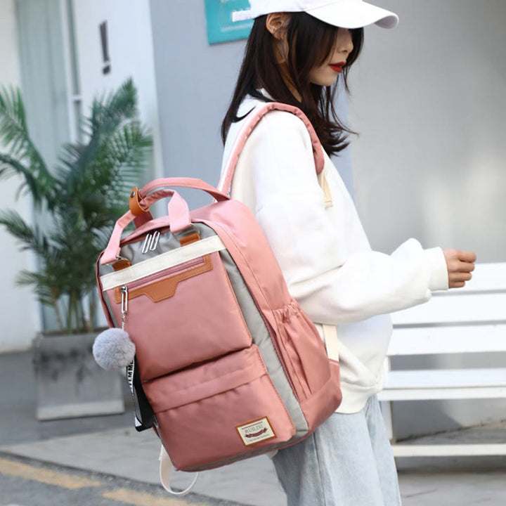Modischer Patchwork-Rucksack mit Farbblockdesign und mehreren Taschen