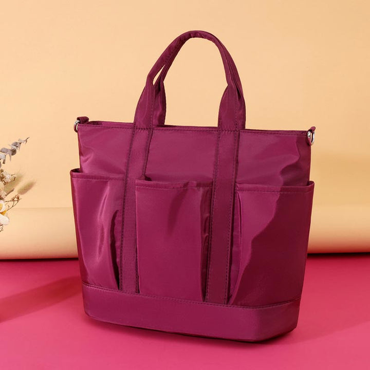 Tragetasche für Damen, minimalistische, wasserdichte Umhängetasche aus Oxford-Gewebe in Lila