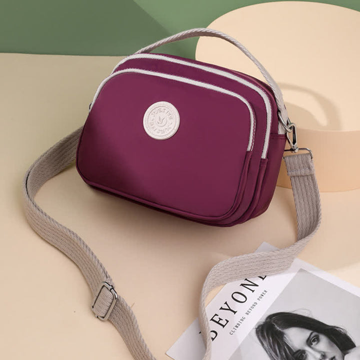 Kleine Handtasche mit dreifachem Reißverschluss für Damen, leichte, wasserdichte Umhängetasche