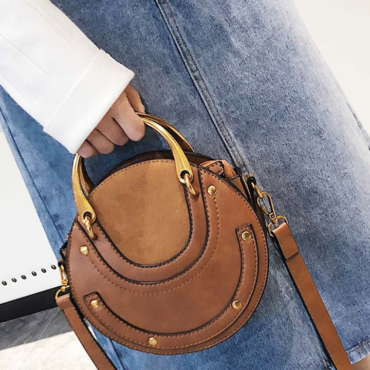 Elegante, runde Top-Grifftasche mit großem Fassungsvermögen und metallischem Griff