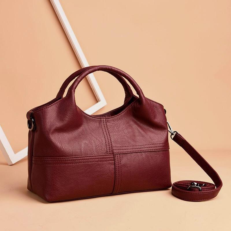 Weiche Lederhandtasche mit Nähten und fester Umhängetasche