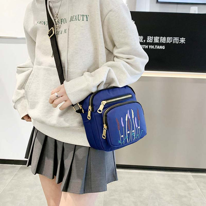 Leichte, wasser- und reißfeste Umhängetasche für Damen mit mehreren Taschen und Stickereien