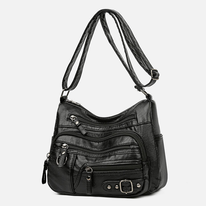 Minimalistische Ledergeldbörse mit mehreren Taschen für Damen. Organisierte Umhängetasche