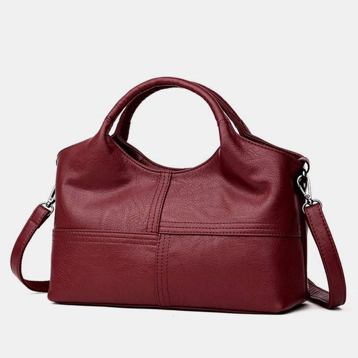 Weiche Lederhandtasche mit Nähten und fester Umhängetasche