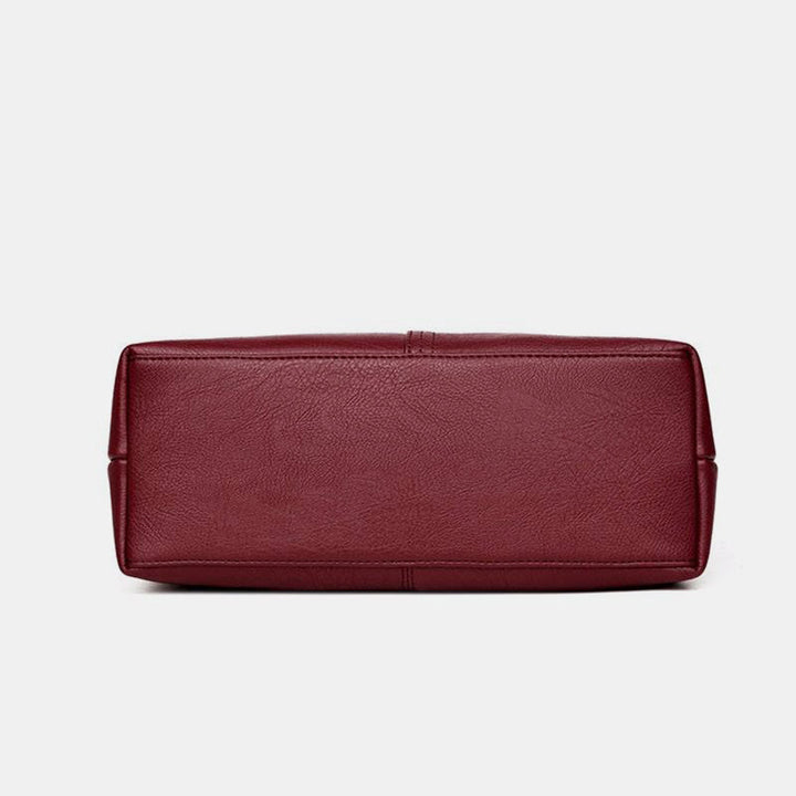 Weiche Lederhandtasche mit Nähten und fester Umhängetasche