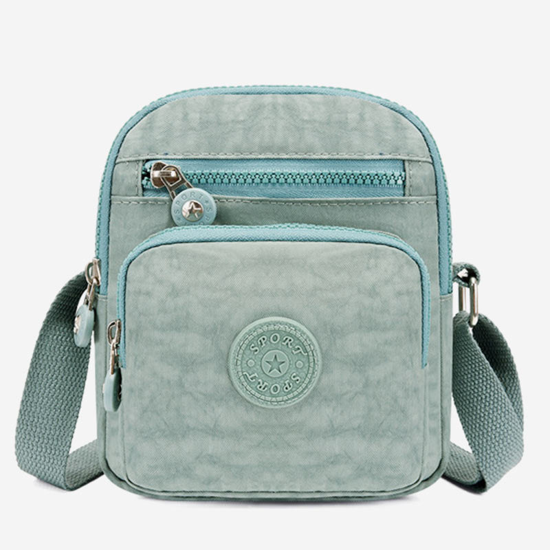 Leichte kleine Umhängetasche in Volltonfarbe mit mehreren Taschen für Mobiltelefone
