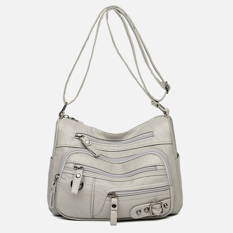Minimalistische Ledergeldbörse mit mehreren Taschen für Damen. Organisierte Umhängetasche