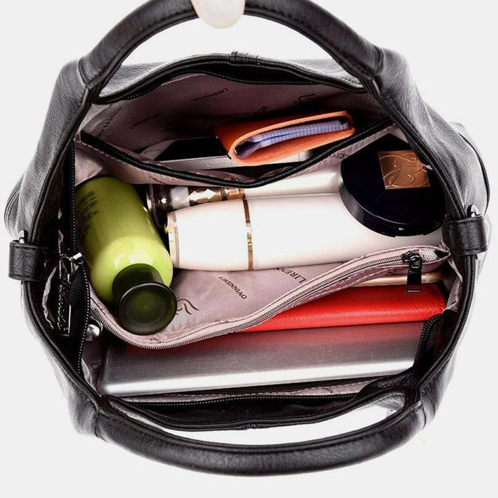 Weiche Lederhandtasche mit Nähten und fester Umhängetasche