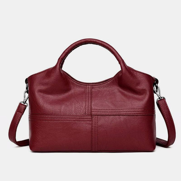 Weiche Lederhandtasche mit Nähten und fester Umhängetasche