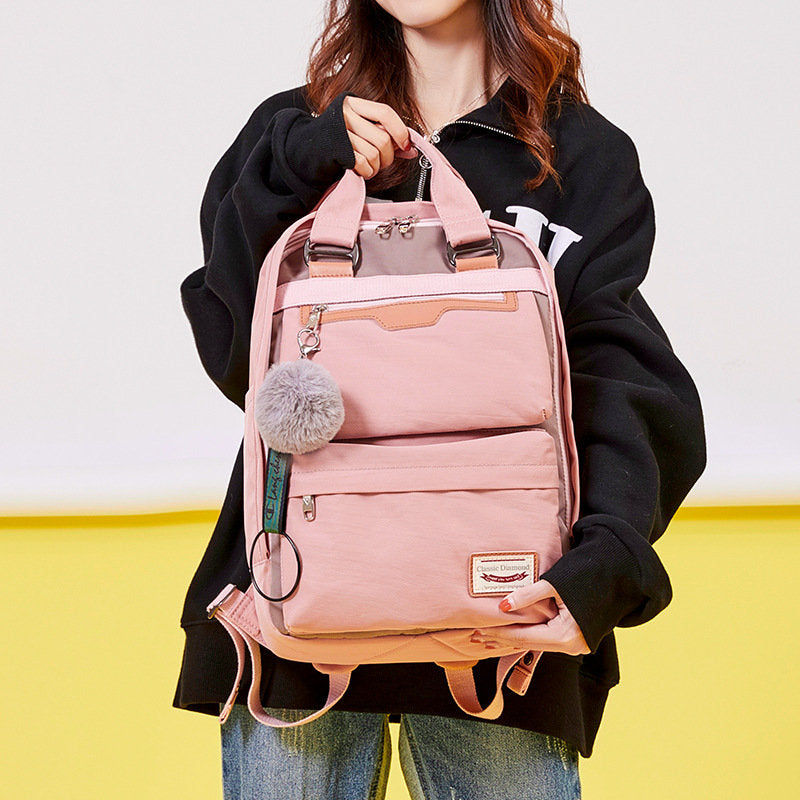 Modischer Patchwork-Rucksack mit Farbblockdesign und mehreren Taschen