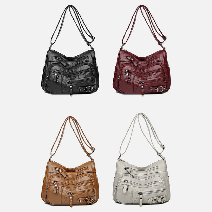 Minimalistische Ledergeldbörse mit mehreren Taschen für Damen. Organisierte Umhängetasche
