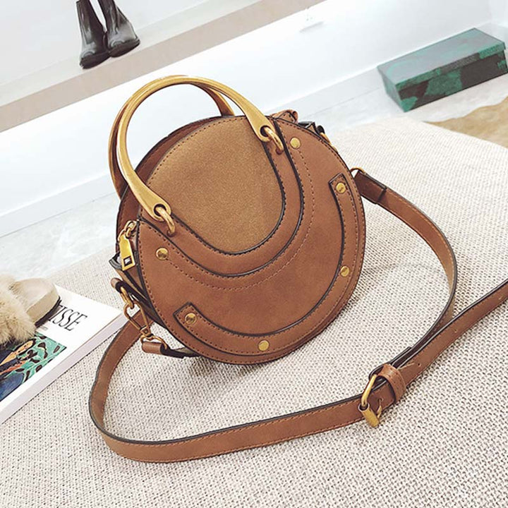 Elegante, runde Top-Grifftasche mit großem Fassungsvermögen und metallischem Griff