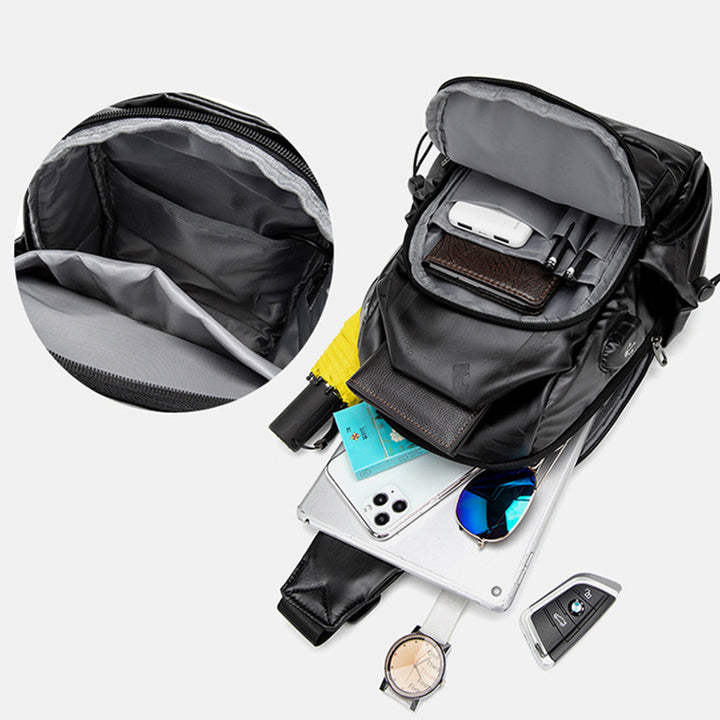 Kleine schwarze Sling-Umhängetasche für Damen und Herren, Tagesrucksack mit USB-Ladegerät